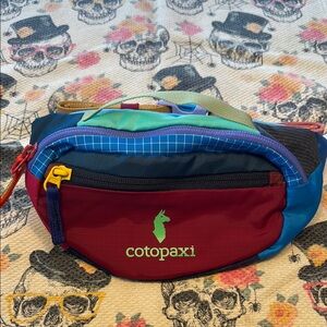 Cotopaxi Red and Blue Belt Bag Vibrant Design